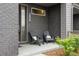 Cozy front porch with chairs, offering a welcoming outdoor space and stylish curb appeal at 928 Cimarron Dr # C, Lafayette, CO 80026
