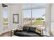 Comfortable living room area filled with natural light from a large window and an outside view at 928 Cimarron Dr # C, Lafayette, CO 80026
