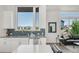 Bright, open living space showcasing stylish cabinetry, stainless appliances, and contemporary design at 928 Cimarron Dr # C, Lafayette, CO 80026