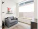 Bright home office space featuring a comfortable couch, natural light, and modern decor at 928 Cimarron Dr # C, Lafayette, CO 80026