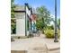 Quaint commercial building exterior, featuring flowers, and a 'Pub' sign, inviting visitors at 928 Cimarron Dr # C, Lafayette, CO 80026