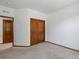 Bedroom with closet and an entrance, neutral walls, and carpet at 7254 S Kellerman Way, Aurora, CO 80016