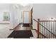 Open entryway with decorative tile and stairs leading to the upper level of the home at 7254 S Kellerman Way, Aurora, CO 80016