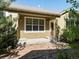 Cozy patio with a door, and rock landscaping at 7254 S Kellerman Way, Aurora, CO 80016