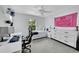 Bedroom with white furnishings, a ceiling fan, and sports memorabilia displayed at 7064 E 2Nd Ave, Denver, CO 80220