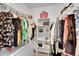 Walk-in closet with ample storage, including hanging racks and shelving at 7064 E 2Nd Ave, Denver, CO 80220