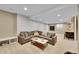Spacious living room featuring a comfortable sectional sofa and recessed lighting at 7064 E 2Nd Ave, Denver, CO 80220