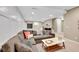 Cozy living room with a sectional sofa, recessed lights, and a decorative wall at 7064 E 2Nd Ave, Denver, CO 80220