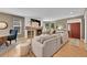 Comfortable living room with hardwood floors, fireplace, and plenty of seating for relaxation and entertaining at 7064 E 2Nd Ave, Denver, CO 80220