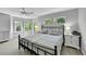 Bright primary bedroom with a bay window and ample natural light at 7064 E 2Nd Ave, Denver, CO 80220