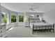 Bright primary bedroom with a bay window and ample natural light at 7064 E 2Nd Ave, Denver, CO 80220