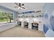 Spacious office with three work stations, custom shelves, and mountain view window at 7064 E 2Nd Ave, Denver, CO 80220