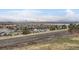 Elevated view of building exteriors from across the street and open space at 821 Stony Mesa Pl, Castle Rock, CO 80108