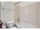 The bathroom features a white bathtub with tiled wall and a standard white toilet at 821 Stony Mesa Pl, Castle Rock, CO 80108