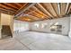 Unfinished basement with a sliding glass door and egress windows at 786 Sundance Ln, Erie, CO 80516