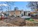 Untidy backyard with various items and bare landscaping at 1599 W Beekman Pl, Denver, CO 80221