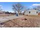 Backyard featuring a basketball hoop, court, and minimal landscaping at 1599 W Beekman Pl, Denver, CO 80221