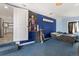 Bedroom with blue walls and carpet featuring an accent poster at 1599 W Beekman Pl, Denver, CO 80221