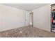 Bedroom with plush carpet and neutral walls, offering a versatile space for various needs at 1599 W Beekman Pl, Denver, CO 80221