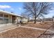 Modest single-story home with a lawn on a sunny day at 1599 W Beekman Pl, Denver, CO 80221