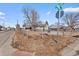 Corner lot property featuring a full yard and street view at 1599 W Beekman Pl, Denver, CO 80221