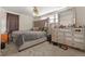 Bedroom with plush carpet, light fan, large mirror, and ample closet space at 1599 W Beekman Pl, Denver, CO 80221