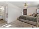 Bedroom featuring plush carpet, a ceiling fan, and natural light from the window at 1599 W Beekman Pl, Denver, CO 80221