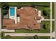 An aerial view showcases the layout of the home, its patio, pool, and manicured landscaping at 343 S Gaylord St, Denver, CO 80209