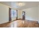 Spacious dining area with hardwood floors and kitchen access at 3637 Lowell Blvd, Denver, CO 80211