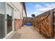 Fenced backyard and sliding glass door leading to the interior of the home at 4555 S Lowell Blvd, Denver, CO 80236
