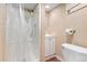 Full bathroom with a shower, toilet and vanity with storage at 4555 S Lowell Blvd, Denver, CO 80236