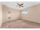 Bedroom featuring neutral walls, carpeted floor, and a ceiling fan at 4555 S Lowell Blvd, Denver, CO 80236