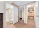 Hallway area shows access to the bathroom with shower and toilet and storage at 4555 S Lowell Blvd, Denver, CO 80236