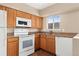 Functional kitchen with an electric range and ample counter space at 4555 S Lowell Blvd, Denver, CO 80236