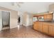 Open-concept kitchen with tile floors and bright neutral paint at 4555 S Lowell Blvd, Denver, CO 80236
