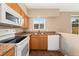 Close-up of kitchen featuring appliances, cabinets, and natural light at 4555 S Lowell Blvd, Denver, CO 80236