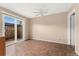 Bright room featuring sliding glass doors to patio and neutral color palette at 4555 S Lowell Blvd, Denver, CO 80236