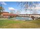 Community pool area with lounge chairs, picnic table, and grassy area at 4555 S Lowell Blvd, Denver, CO 80236
