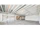 Spacious unfinished basement with concrete floors, partially finished walls, and exposed ceiling at 1957 S Coolidge Way, Aurora, CO 80018