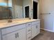 Elegant bathroom featuring double sinks, white cabinetry, and modern fixtures at 1957 S Coolidge Way, Aurora, CO 80018