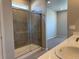 Stylish bathroom with glass shower, dual sinks, and modern vanity at 1957 S Coolidge Way, Aurora, CO 80018
