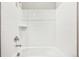 Fresh bathroom with a shower over tub combination and a classic all-white tiled surround at 1957 S Coolidge Way, Aurora, CO 80018