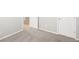 Bedroom with neutral walls, carpet, and a full-size door leading out of the room at 1957 S Coolidge Way, Aurora, CO 80018