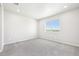 Carpeted bedroom with neutral walls and large windows providing natural light at 1957 S Coolidge Way, Aurora, CO 80018