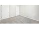 Bright bedroom with neutral walls, plush gray carpeting and two closets, ready for personalization at 1957 S Coolidge Way, Aurora, CO 80018
