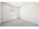 Simple bedroom with neutral carpet and a window offering natural light at 1957 S Coolidge Way, Aurora, CO 80018