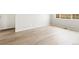 Bright, airy bedroom with hardwood floors and plenty of natural light from the window at 1957 S Coolidge Way, Aurora, CO 80018