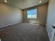 Well-lit bedroom features a spacious area and scenic window views at 1957 S Coolidge Way, Aurora, CO 80018