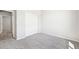 Cozy bedroom showcasing neutral paint, a closet with sliding doors, and plush gray carpeting at 1957 S Coolidge Way, Aurora, CO 80018