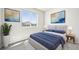 Well-lit bedroom with a large window, stylish decor, and modern furnishings at 1957 S Coolidge Way, Aurora, CO 80018